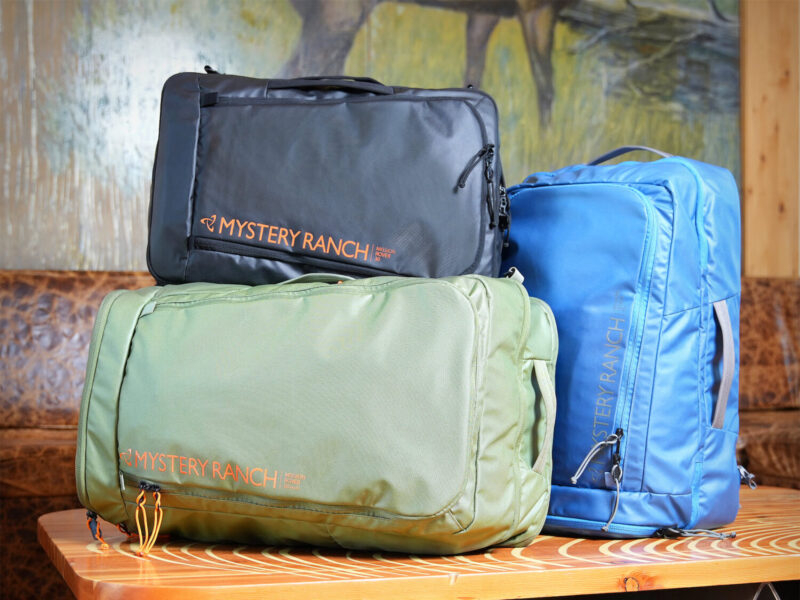 A group of three MYSTERY RANCH MISSION ROVER backpacks on a table